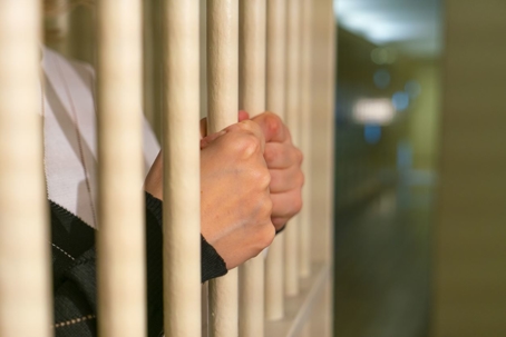 Young child behind bars